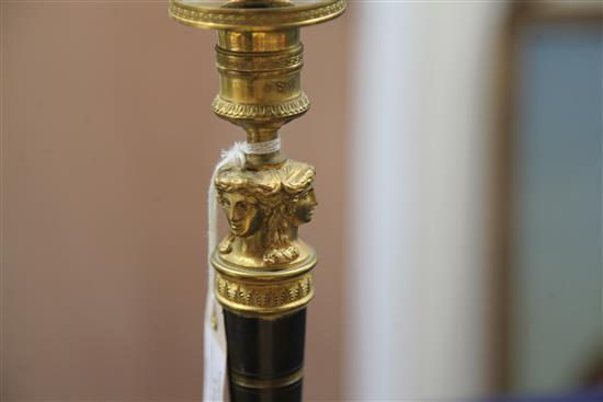 A pair of Empire style bronzed ormolu candlesticks, 10.5in.